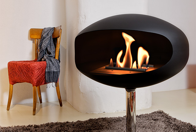Naked Flame Biofuel Fireplaces NZ - Cocoon Fires - Modern Oval Black Standing by Chair