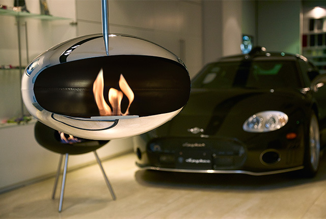 Naked Flame Biofuel Fireplaces NZ - Cocoon Fires - 2 Modern Oval Reflective Hanging by Chair