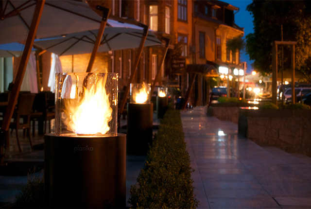 Naked Flame Biofuel Fireplaces NZ - Planika - Outdoor Columns lining Restaurant