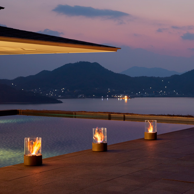 Fireplace Design Inspiration - Row Of Tea Lights Lining Outdoor Pool