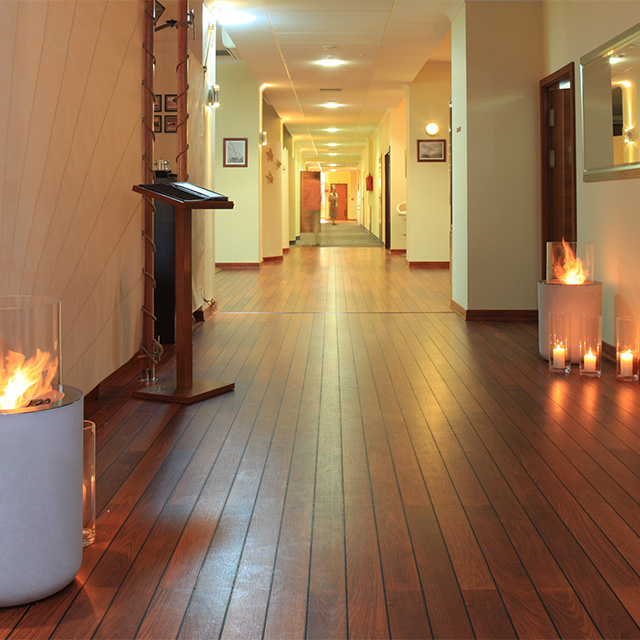 Fireplace Design Inspiration - Black Columns Lining Hotel Hallway